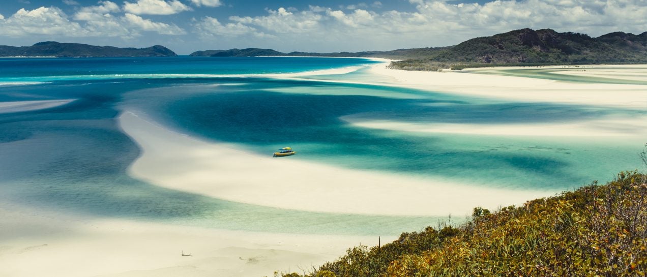 Whitesundays beach and boat anchored