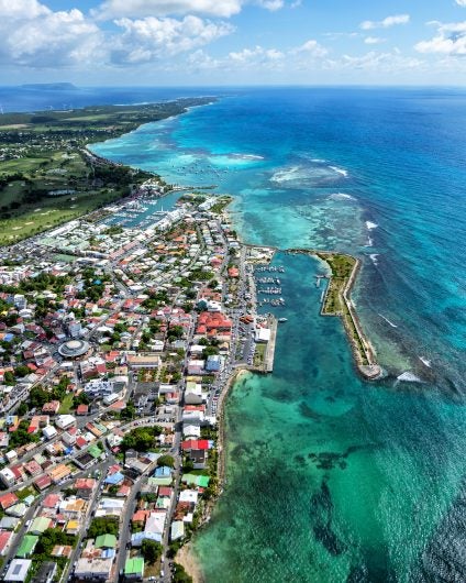 Guadeloupe coast colorful beach houses crystal waters